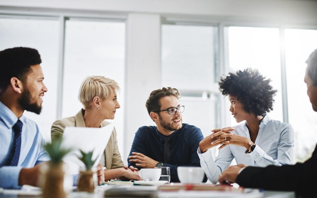 Group of young coworkers in a meeting.