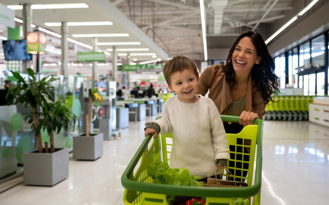 Mother and child shopping for healthy grocery items
