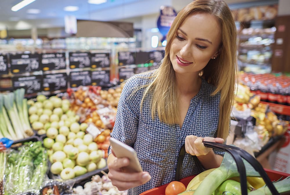 Healthy Benefits Plus member shopping for fresh produce