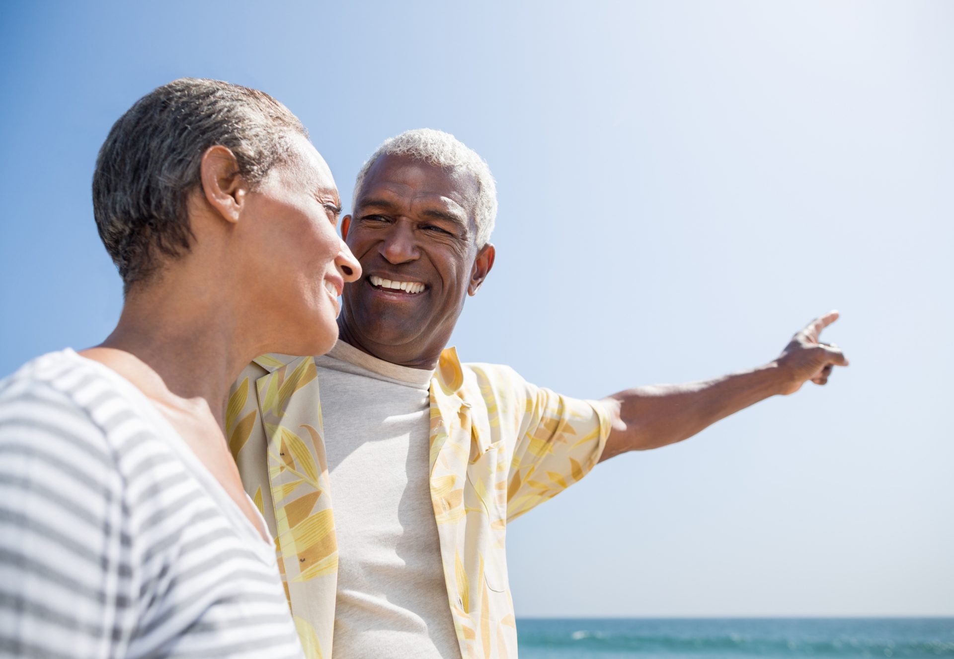 Medicare couple enjoying the beach.