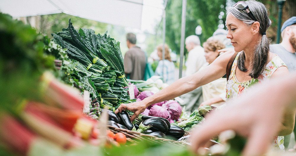 Medicare member using her benefits at produce market