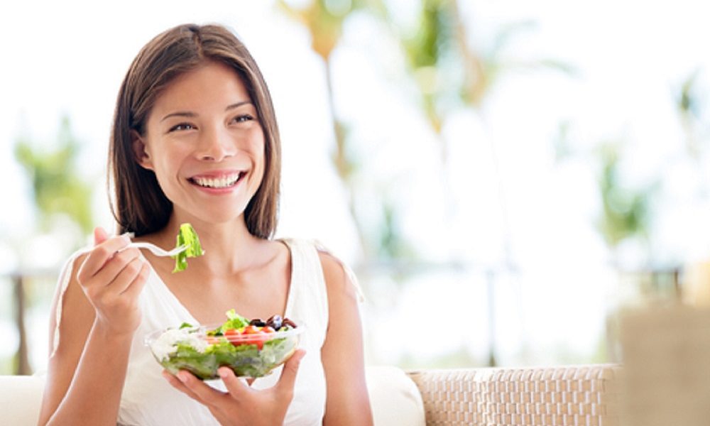 Healthy women enjoying a salad