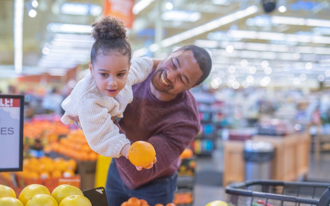 Father and daughter using their governement food benefits